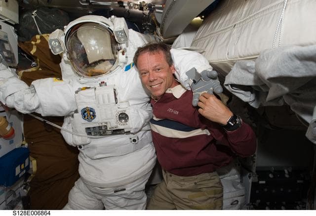 NASA image: Fuglesang Stows EMU on MDDK