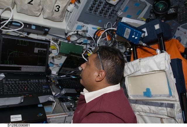 NASA image: Hernandez on Flight Deck during Approach OPS