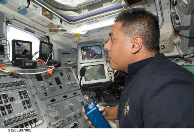 NASA image: Hernandez on AFT Flight Deck (FD) at Remote Manipulator System (RMS) controls