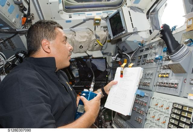 NASA image: Hernandez on AFT Flight Deck (FD) at Remote Manipulator System (RMS) controls
