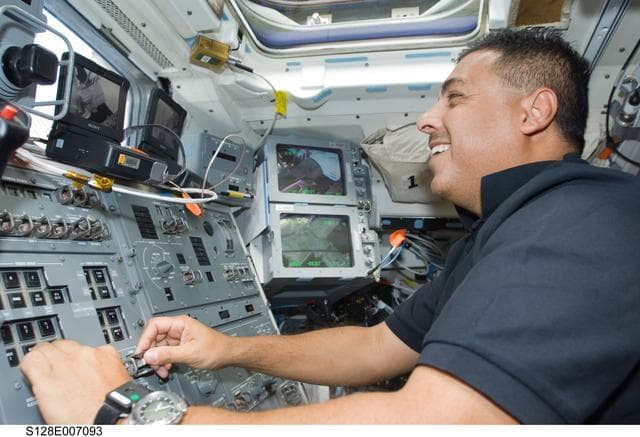 NASA image: Hernandez on AFT Flight Deck (FD) at Remote Manipulator System (RMS) controls
