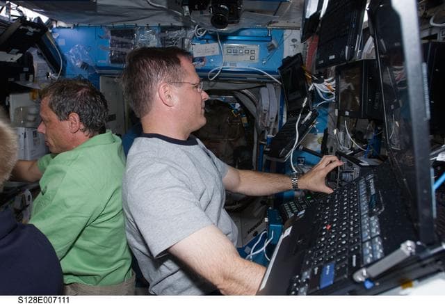 NASA image: Multi- Purpose Logistics Module (MPLM) Unberth to Installation from Robotics Workstation (RWS)