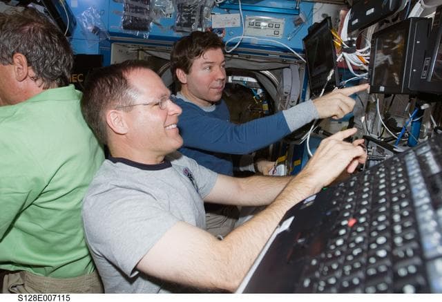 NASA image: Multi- Purpose Logistics Module (MPLM) Unberth to Installation from Robotics Workstation (RWS)