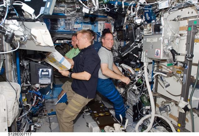 NASA image: Multi- Purpose Logistics Module (MPLM) Unberth to Installation from Robotics Workstation (RWS)
