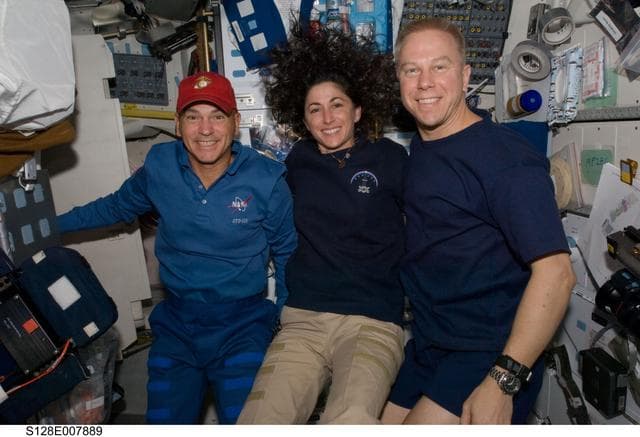 NASA image: Sturckow, Stott, and Kopra pose on MDDK