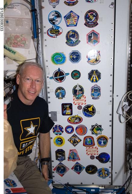 NASA image: Crew poses at patch wall in Node 1
