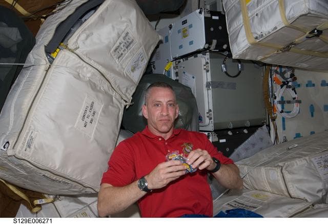 NASA image: View of CDR Hobaugh posing for a photo on the MDDK