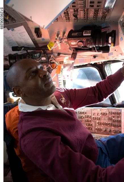 NASA image: View of MS4 Satcher working on the Flight Deck