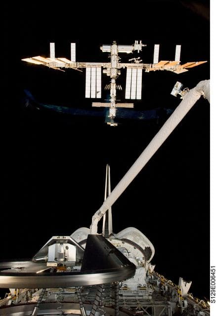 NASA image: Exterior view of Atlantis and ISS as seen through an aft Flight Deck Window during Rendezvous Operations