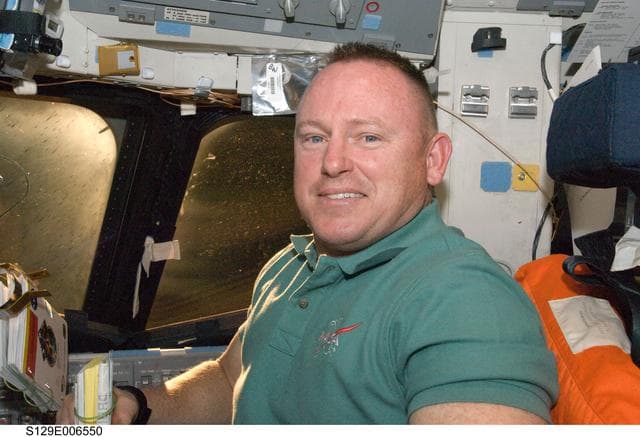 NASA image: STS-129 Pilot Wilmore poses for a photo on the FD