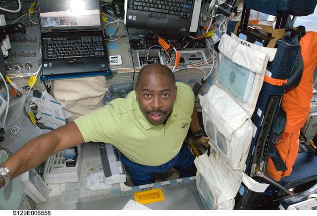 NASA image: STS-129 MS1 Melvin poses for a photo on the FD