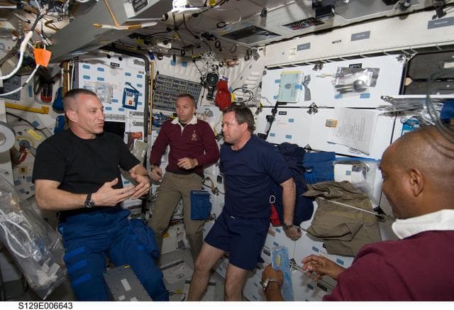 STS-129 Crew Members on the Middeck