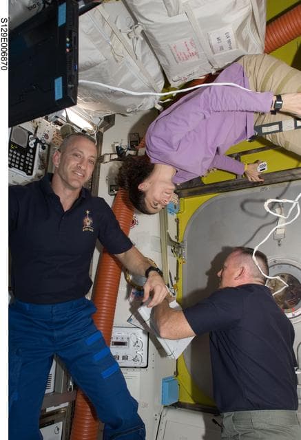 View of Crew Members in the Airlock during STS-129/ Expedition 21 Joint Operations