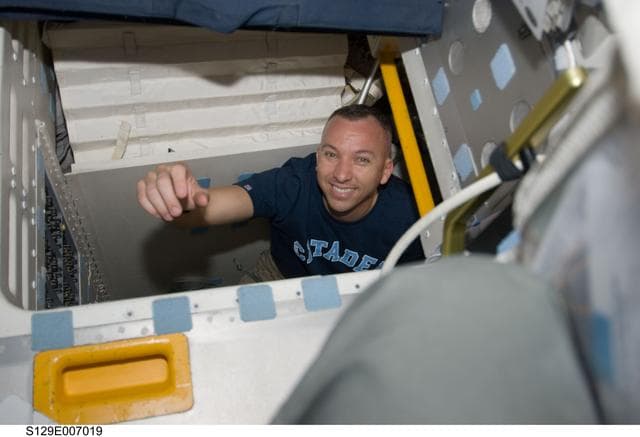 NASA image: View of MS2 Bresnik posing for a photo