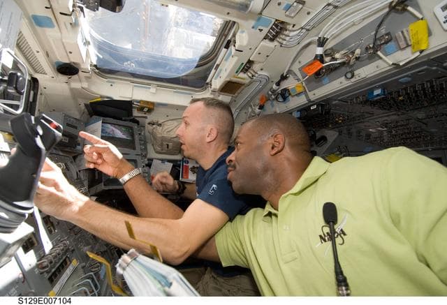 NASA image: STS-129 Crew Members transfer the ELC1 from the Payload Bay to the ISS