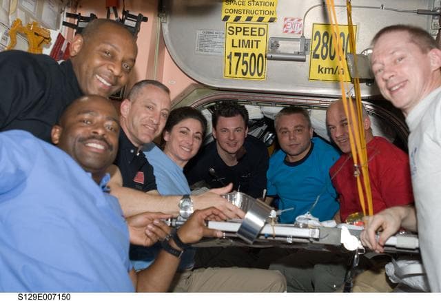 NASA image: STS-129/Expedition 21 Crew Members enjoy a meal together in the Node 1