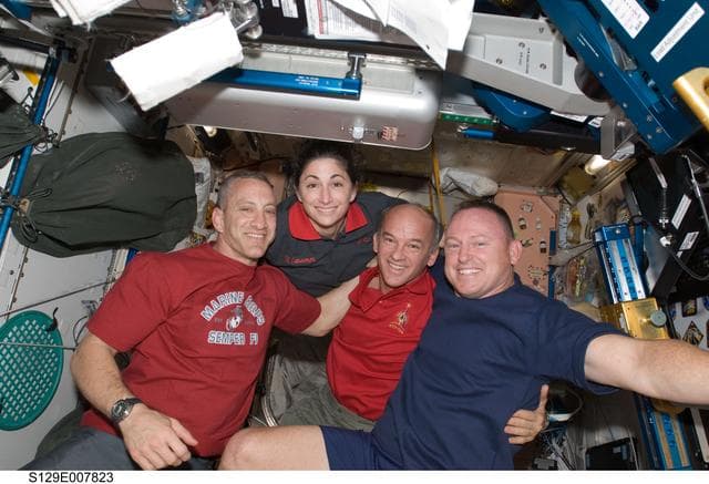 NASA image: STS-129/Expedition 21 Crew Members posing for a photo on the ISS