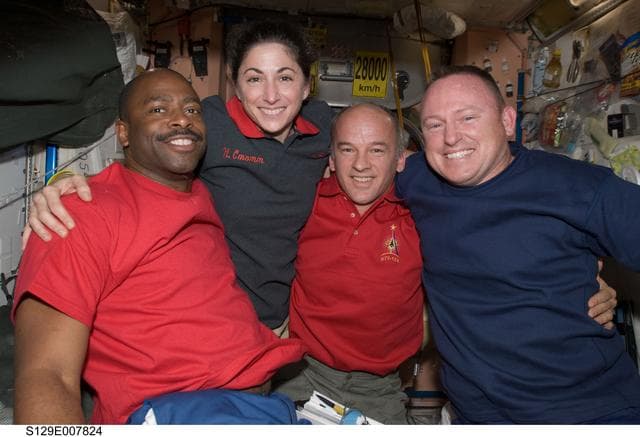 NASA image: STS-129/Expedition 21 Crew Members posing for a photo on the ISS
