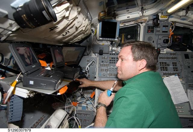 NASA image: STS-129 MS3 Foreman monitors EVA3 from the Atlantis Flight Deck