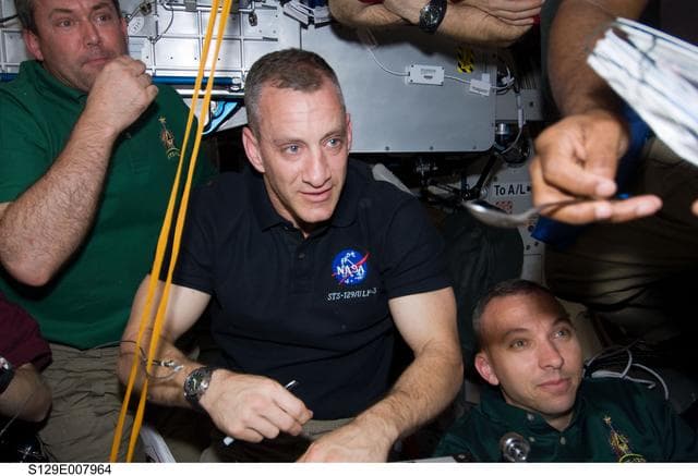 NASA image: STS-129/Expedition 21 Crew Members enjoy a meal together in the Node 1