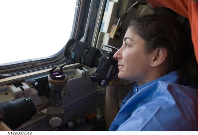 NASA image: View of MS Stott taking photos on the Atlantis Flight Deck