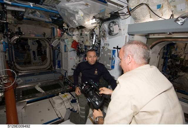 NASA image: View of Expedition 21 and STS-129 Crew Members working in the Node 2