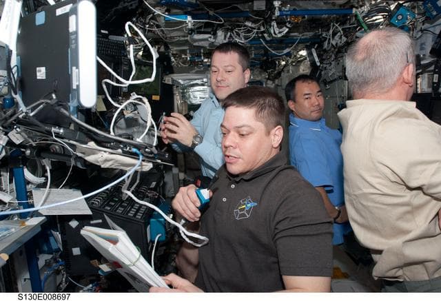 NASA image: Crewmembers in US Lab during PMA-3 Relocation OPS
