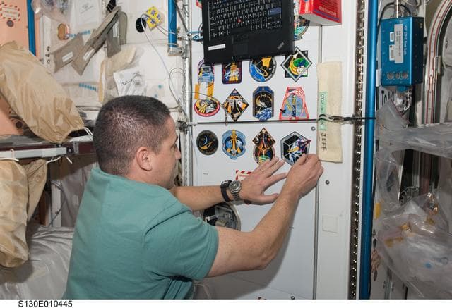 NASA image: Zamka Places STS-130 Mission Patch in Node 1