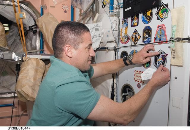 NASA image: Zamka Places STS-130 Mission Patch in Node 1