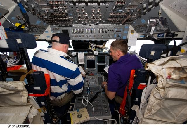 NASA image: Poindexter and Dutton on Discovery flight deck