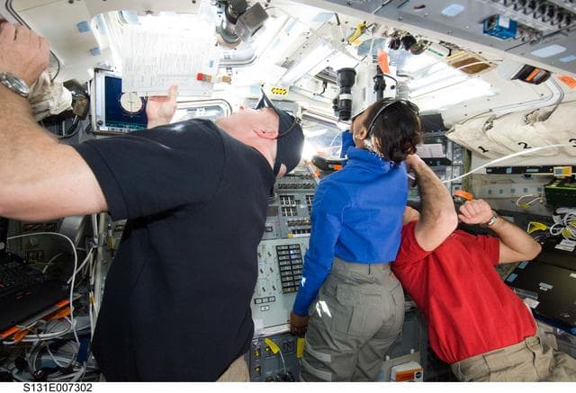 NASA image: Poindexter, Wilson and Mastracchio on AFT Flight Deck during Approach OPS