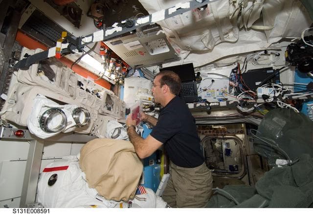 NASA image: EMU Prep in Joint Airlock