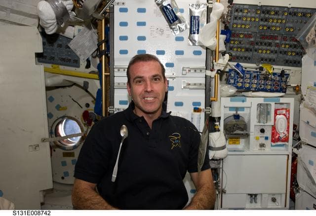 NASA image: Mastracchio eats on MDDK