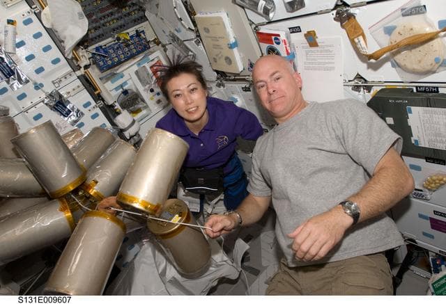 NASA image: Poindexter and Yamazaki with LIOH Canisters