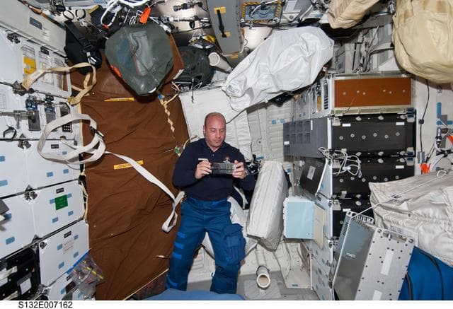 NASA image: Reisman holds GAP in the FWD MDDK during STS-132