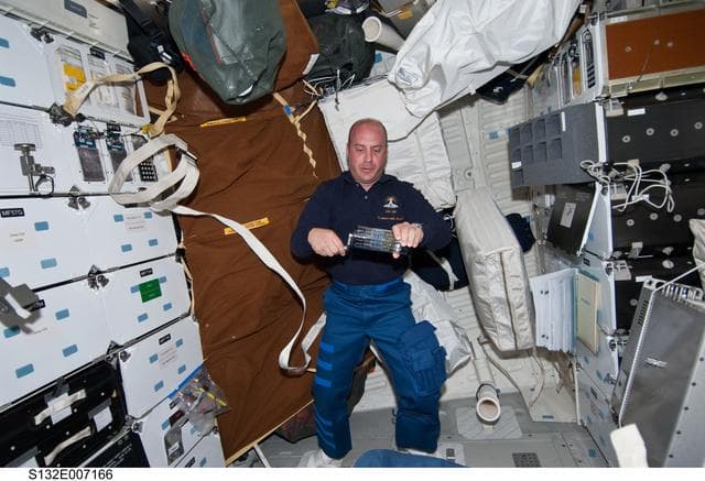 NASA image: Reisman holds GAP in the FWD MDDK during STS-132