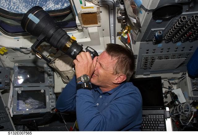 NASA image: Sellers takes photo at window in the FD during STS-132