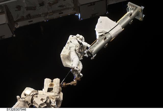 NASA image: Reisman attached to an APFR on EVA 1 during Joint Operations