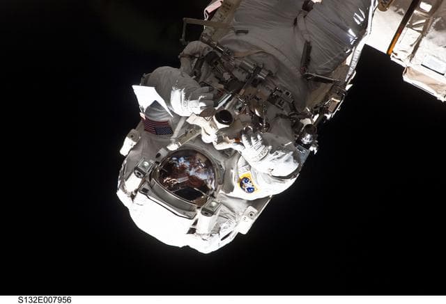 NASA image: Reisman attached to an APFR on EVA 1 during Joint Operations