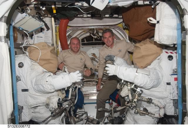 NASA image: Reisman and Good pose in the A/L during Joint Operations