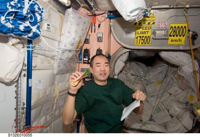 NASA image: Noguchi holds taco in the Node 1 during Joint Operations