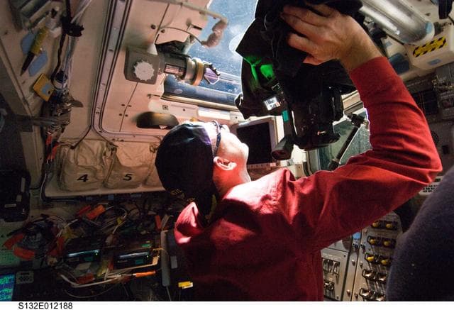NASA image: Antonelli uses video camera at aft FD window of Space Shuttle Atlantis