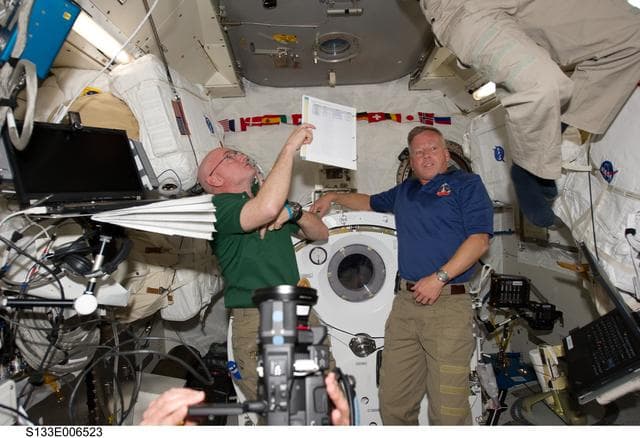 NASA image: STS-133 and Expedition 26 crew in JPM