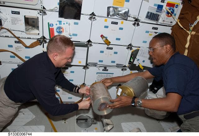 NASA image: Boe and Drew perform LiOH changeout