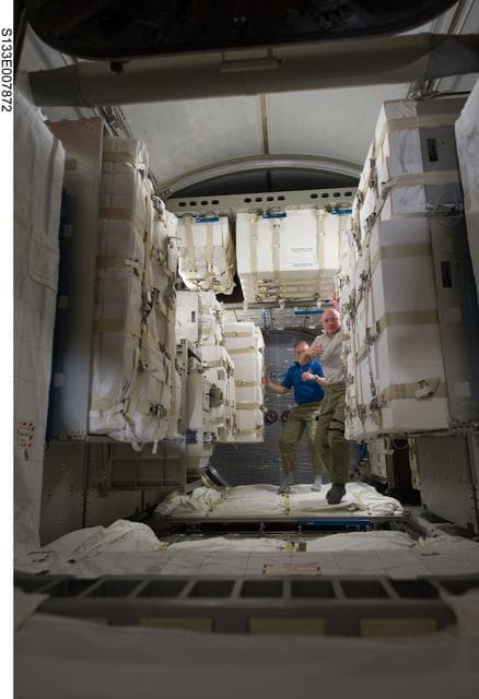 NASA image: STS-133 and Expedition 26 crew enter PMM (Permanent Multipurpose Module)