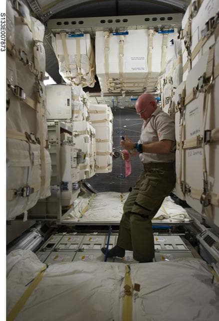 NASA image: STS-133 and Expedition 26 crew enter PMM (Permanent Multipurpose Module)