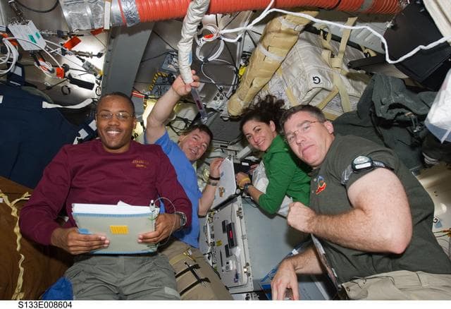 NASA image: STS-133 and Expedition 26 crew on middeck