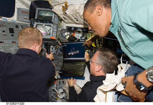 NASA image: Boe,Lindsey and Drew on aft flight deck