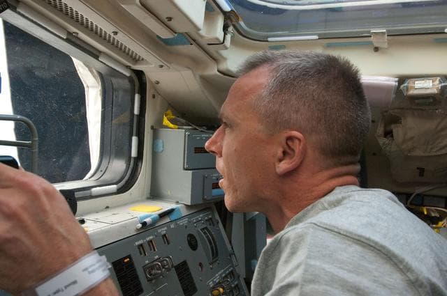 NASA image: View of STS-134 MS Feustel working on the Flight Deck
