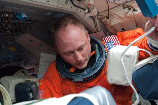 NASA image: View of STS-134 MS Fincke on the Flight Deck